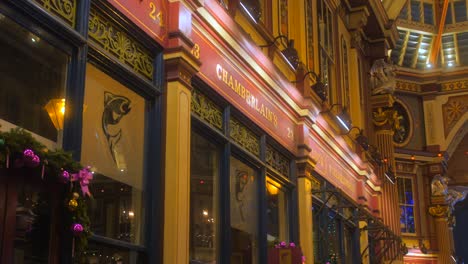 Illuminated-Covered-Market-And-Tourist-Attraction-At-Leadenhall-Market-In-The-City-of-London,-United-Kingdom