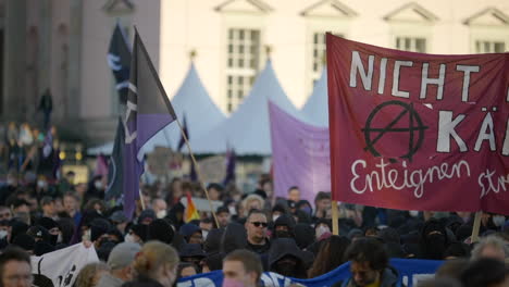 Anarchist-protesters-holding-banners-flag-during-riot-demonstration-in-Berlin