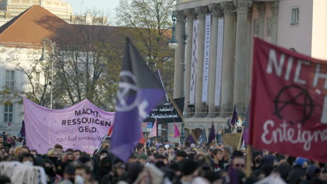 Slow-motion-German-protest-march-with-flags-waving-for-social-economic-situation-in-Berlin