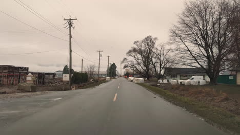 Pov-of-vehicle-drives-Along-empty-road-Aftermath-of-flooding-in-Abbotsford,-British-Columbia