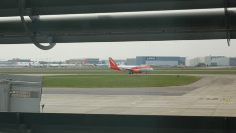 View-of-the-Airbus-factory-in-Toulouse-with-an-Airbus-319-crossing-in-front