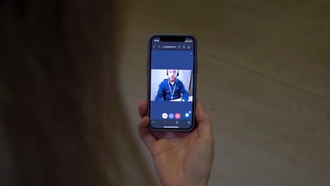 Rotating-shot-of-a-woman-on-a-video-call-to-a-technology-business-employee