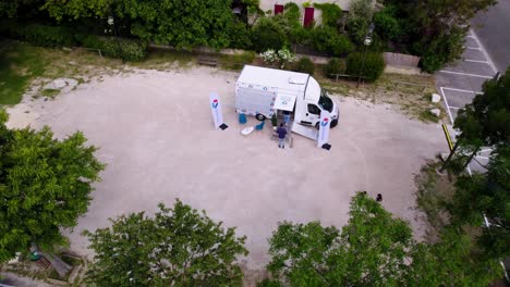 People-entering-the-telecom-shop-in-the-truck