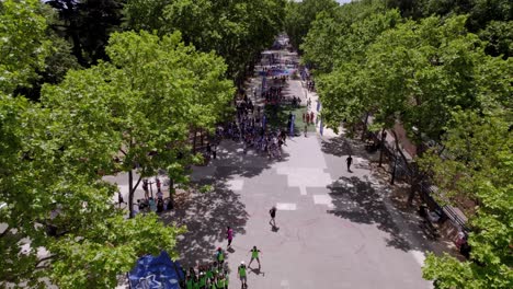 Aerial-view-over-park-in-Montpellier,-France,-with-an-olympic-festival-as-activity-for-the-people-in-the-park