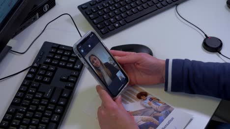 Women-facetiming-each-other-on-the-phone-when-being-in-the-office