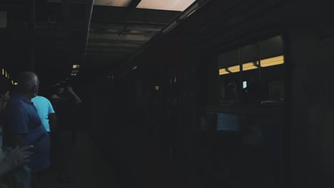 A-Group-of-people-waits-to-board-the-Athens-Metro-arriving-to-the-platform