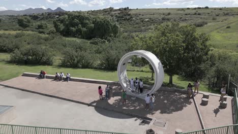 African-tourists-pose-in-huge-pipeline-section-at-Ash-River-Outfall