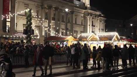 Busy-Scene-Of-People-At-Trafalgar-Square-Christmas-Market-Outside-The-National-Gallery-At-Night-In-London