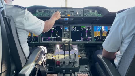 Pilots-in-the-cockpit-of-a-Boeing-787-Dreamliner-operate-a-flight-to-Europe