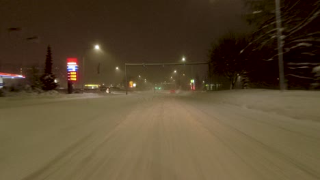 POV-shot-traveling-through-the-snow-covered-streets-within-Helsinki,-finland