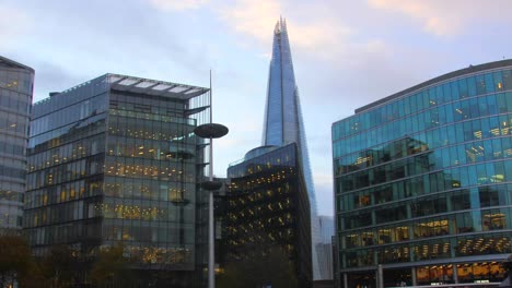 The-Tower-Wing-of-Guy's-Hospital-from-a-low-angle-contrasted-with-the-glass-and-metal-tower-of-the-Shard-looming-