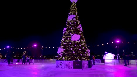 9-December-2022---People-Carefully-Skating-At-Glide-Battersea-Ice-Rink-Around-Christmas-Tree