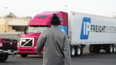 typical-truck-driver-walking-in-slowmotion-to-his-parked-volvo-cascadia-truck