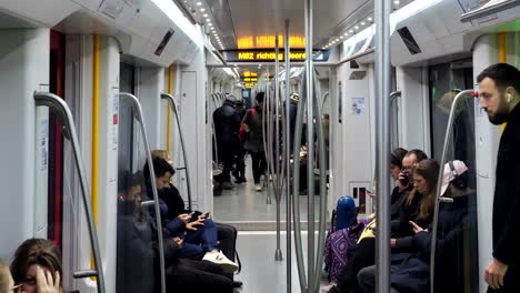 Slow-motion-shot-of-male-commuter-entering-tram-metro-in-Amsterdam,static-shot