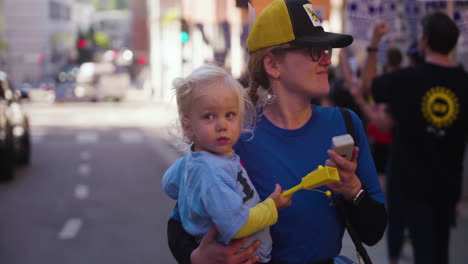 A-Young-Woman-with-a-Baby-Leads-a-Line-of-UC-Academic-Workers-on-Strike-at-UCLA