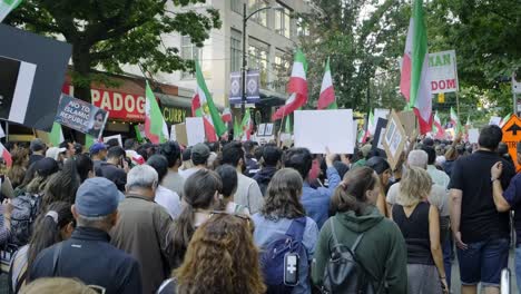 People-Holding-Placards-And-Flags-Demonstrate-Protest-In-Support-Of-Iranians-Protesting-The-Death-Of-Mahsa-Amini