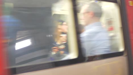 People-waiting-for-the-train-at-subway-station