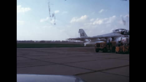 A-truck-stops-near-a-parked-fighter-to-refuel-it