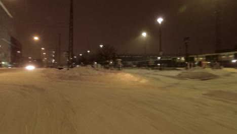 POV-shot-driving-through-downtown-Helsinki-at-nighttime