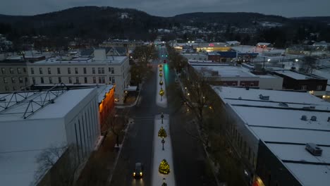 Aerial-dolly-backwards-reverse-reveal-of-small-town-America-in-snow