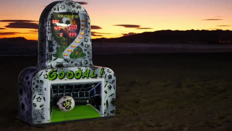 Máquina-Recreativa-De-Patadas-De-Fútbol-En-La-Playa-Al-Atardecer