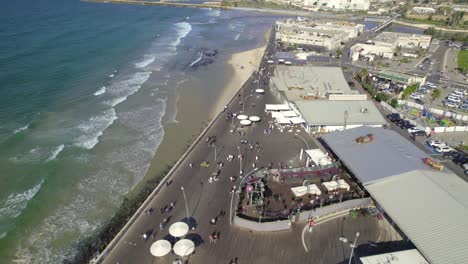 Push-in-tilt-up-over-the-Tel-Aviv-Port-Promenade-on-a-summer-day-#013