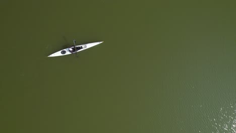 Top-down-view-of-a-man-on-a-white-kayak-in-Yarkon-river-Tel-Aviv-#004