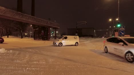 POV-shot-driving-through-busy-streets-and-junctions-in-Helsinki-at-night