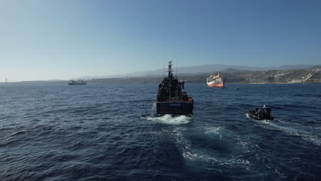 Aerial-shot-from-the-stern-of-the-police-patrol-boat-and-next-to-the-boat-is-a-speedboat-also-from-the-police