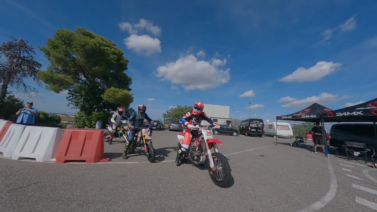 FPV Drone Circles Group Of Motorcycle Riders Leaving Pit And Joining ...
