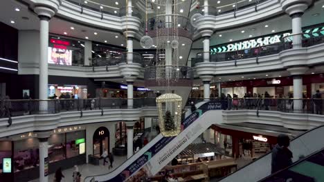 17-December-2022---Inside-View-From-St-Georges-Shopping-Centre-In-Harrow-With-Hanging-Festive-Christmas-Decoration-From-Ceiling