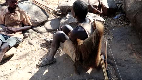 Local-Hadzabe-tribe-gather-talk-to-each-other,-Karatu,-Tanzania,-Africa