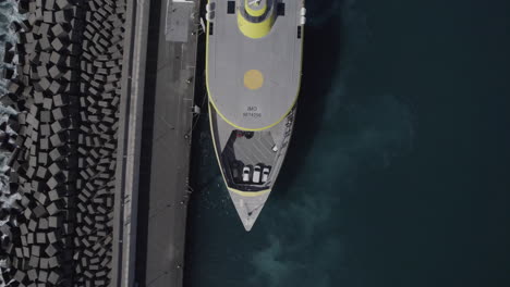 Aerial-shot-of-a-Ferry-boat-docked-in-the-port-of-Agaete