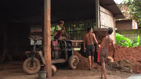 The-process-of-preparing-clay-dough-for-making-pottery-using-a-grinding-machine