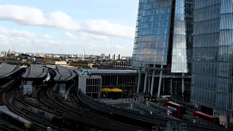 Transportation-into-London-Bridge-Station,-underneath-The-Shard,-London,-United-Kingdom