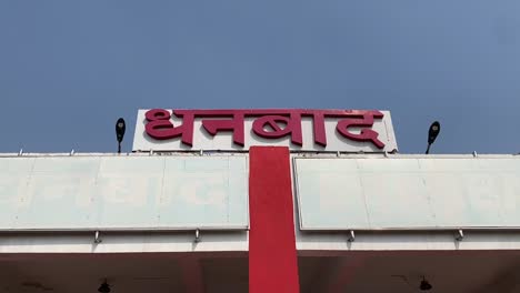 A-view-of-railway-station-name-board-of-Dhanbad,-Jharkhand,-India