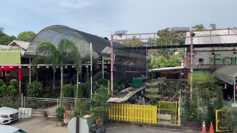 Panning-day-view-of-flora-retail-outlets-along-Thomson-road,-Singapore