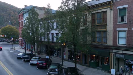 Person-walks-by-historic-buildings-in-downtown-Jim-Thorpe-PA