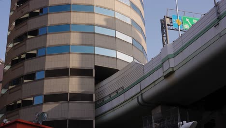 Highway-Passing-Through-Japanese-Gate-Tower-Building