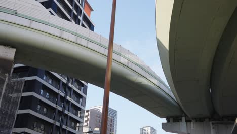 Gate-Tower-Building,-Japanese-Highway-Passing-Through-Office-in-Osaka