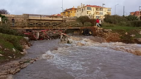 River-full-of-water-and-strong-current-knocked-over-metallic-equipment