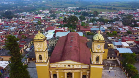 beautiful-aerial-view-with-drone-of-flying-overt-Saint-John-the-Baptist-Parish-of-Coscomatepec,-Veracruz,-Mexico