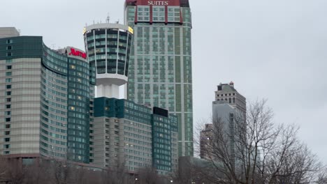 Niagara-Falls,-Ontario-Canada-skyline,-overcast-day,-tourism-hotels-close-up-pan