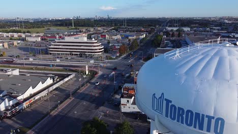 Pull-back-reveal-of-City-of-Toronto-water-tower-logo-at-Golden-Mile-commercial-district-in-Scarborough