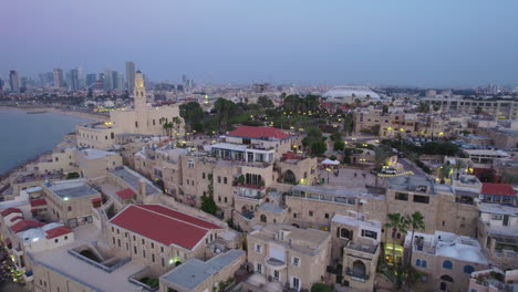 Vista-Aérea-Desde-El-Puerto-Hasta-La-Ciudad-Vieja-De-Jaffa-Por-La-Noche-Durante-Las-Celebraciones-De-Fin-De-Año-22-23