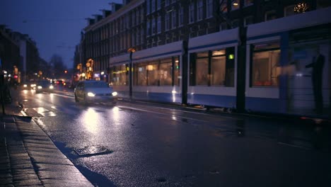 A-rainy-day-in-Amsterdam-De-pijp,-public-transport-tram-is-passing-by