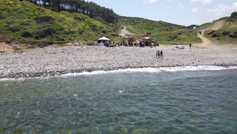 approaching-nomads-living-near-the-sea-with-a-drone