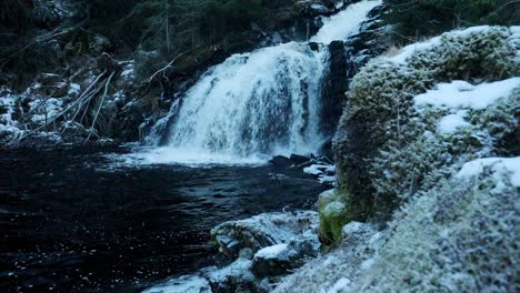 Forest-waterfall-in-winter-setting