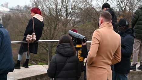 Looking-through-the-telescope-within-Greenwich-Park,-London,-United-Kingdom