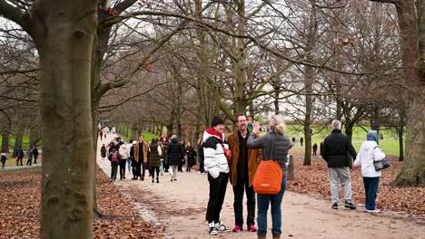 Falling-over-before-taking-a-selfie-in-Greenwich,-London,-United-Kingdom